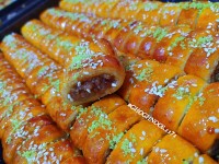 کوساک با عطر خوش دارچین و زنجبیل با مغزی گردو و کشمش