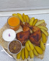 مرغ رب اناری و سیب زمینی در فر و آب پرتقال طبیعی